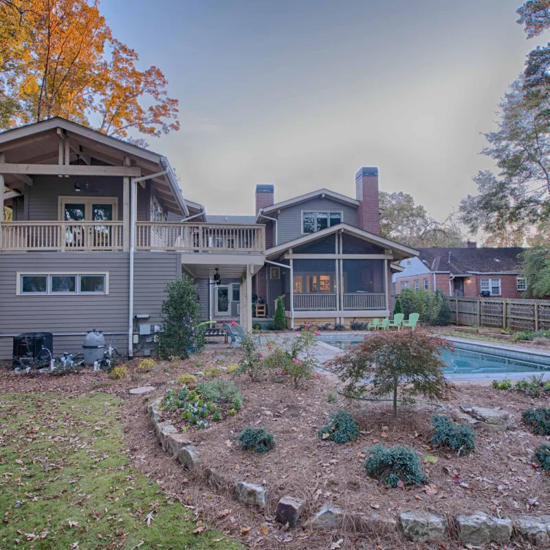a house with a fence and trees