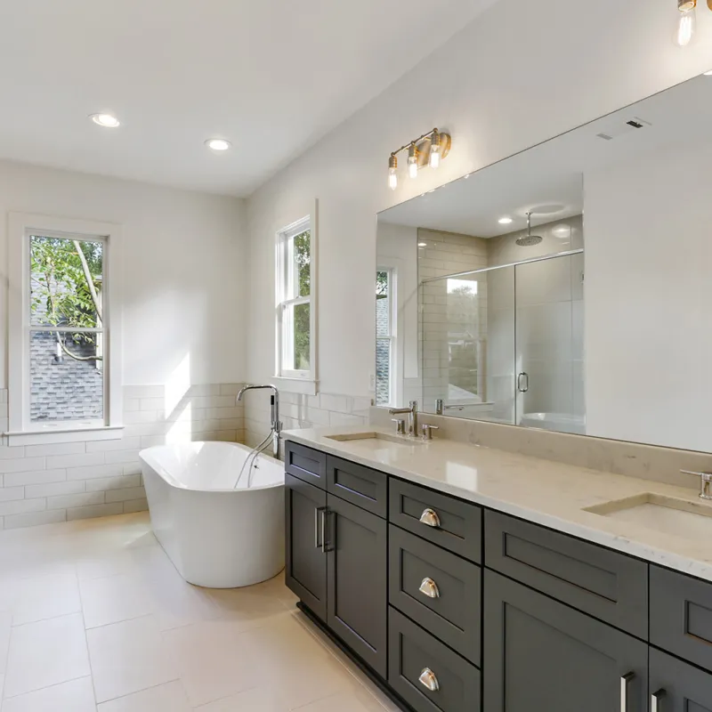 a bathroom with a tub sink and a shower