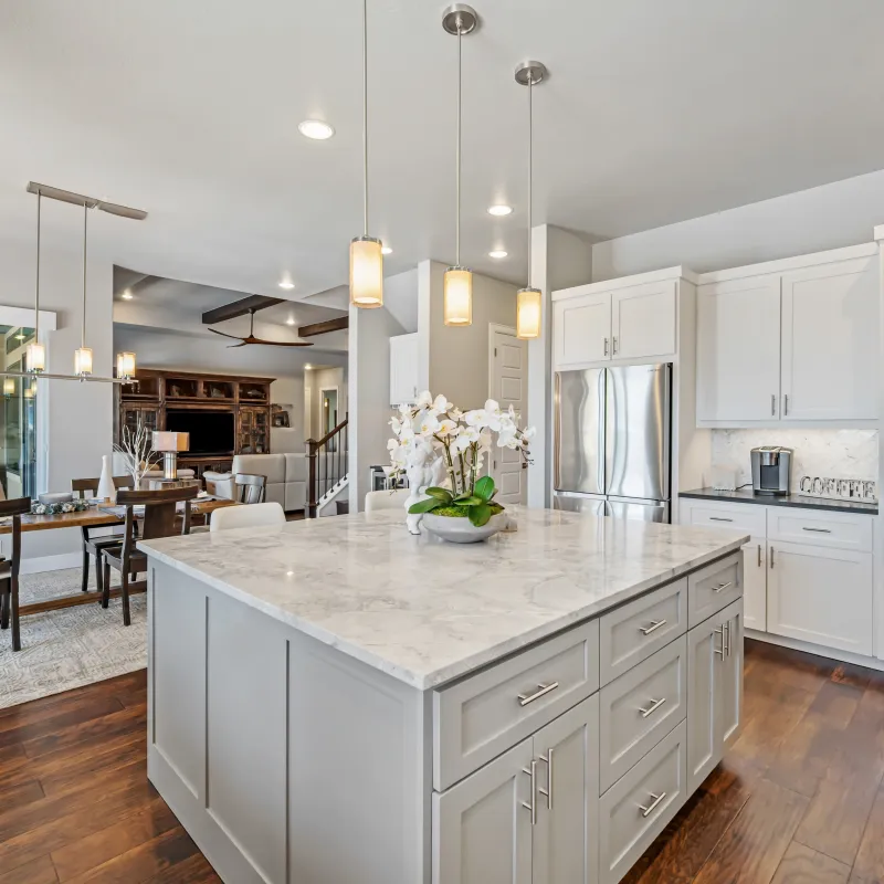 a kitchen with white cabinets