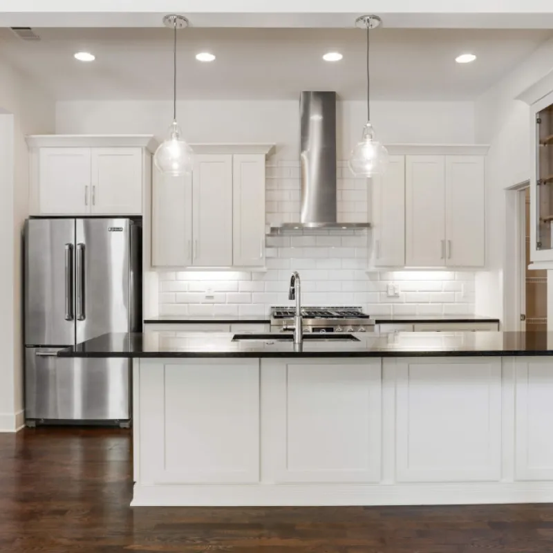 a kitchen with white cabinets