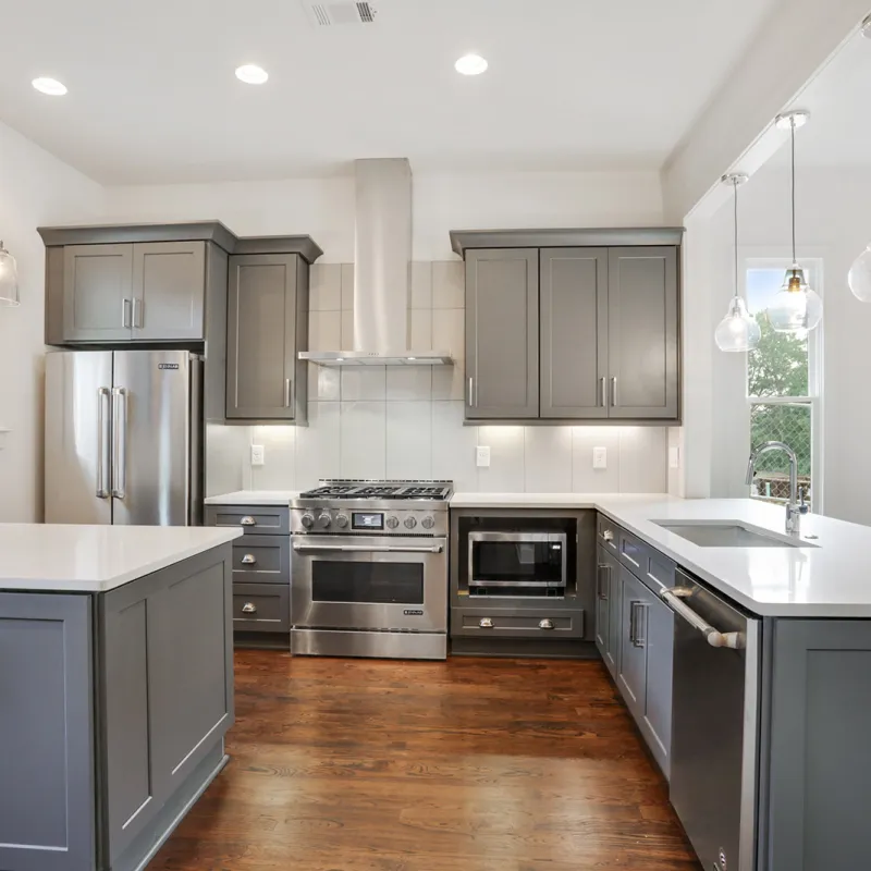 a kitchen with black cabinets