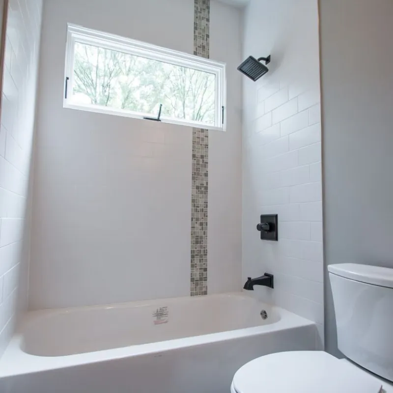 a bathroom with a tub toilet and sink