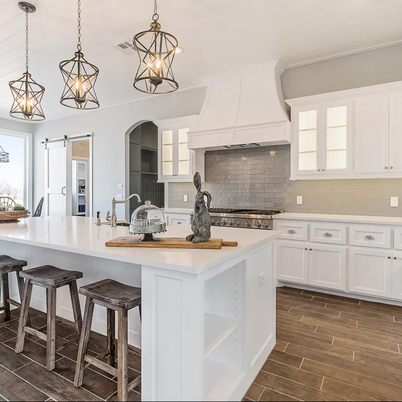 a kitchen with white cabinets