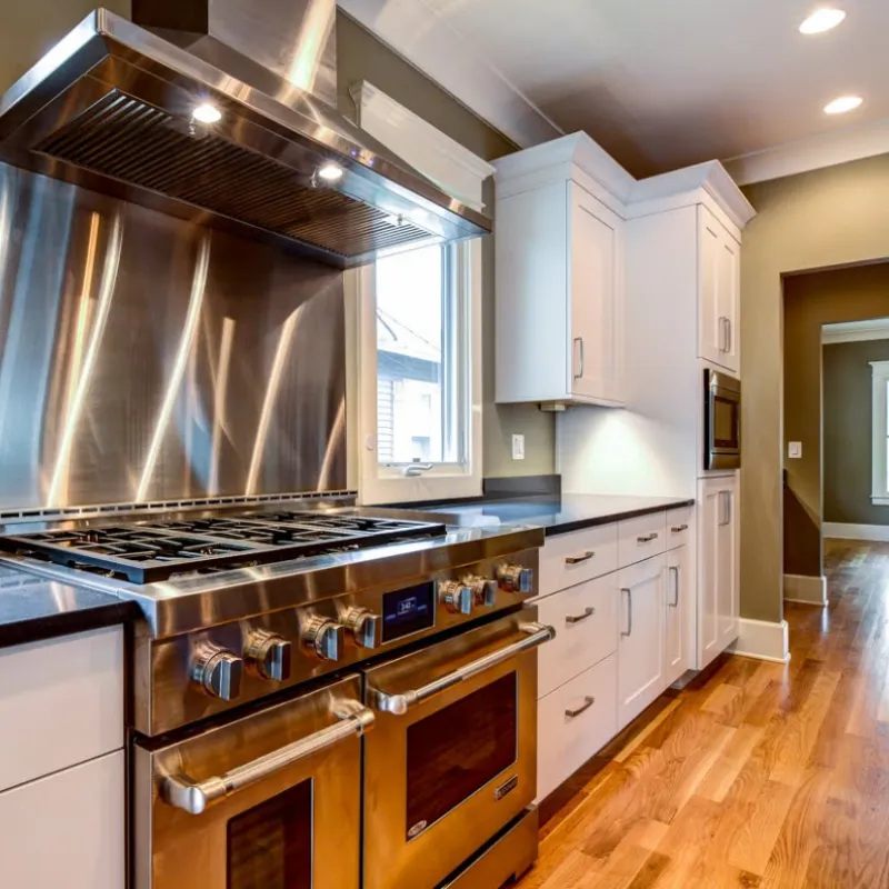 a kitchen with white cabinets