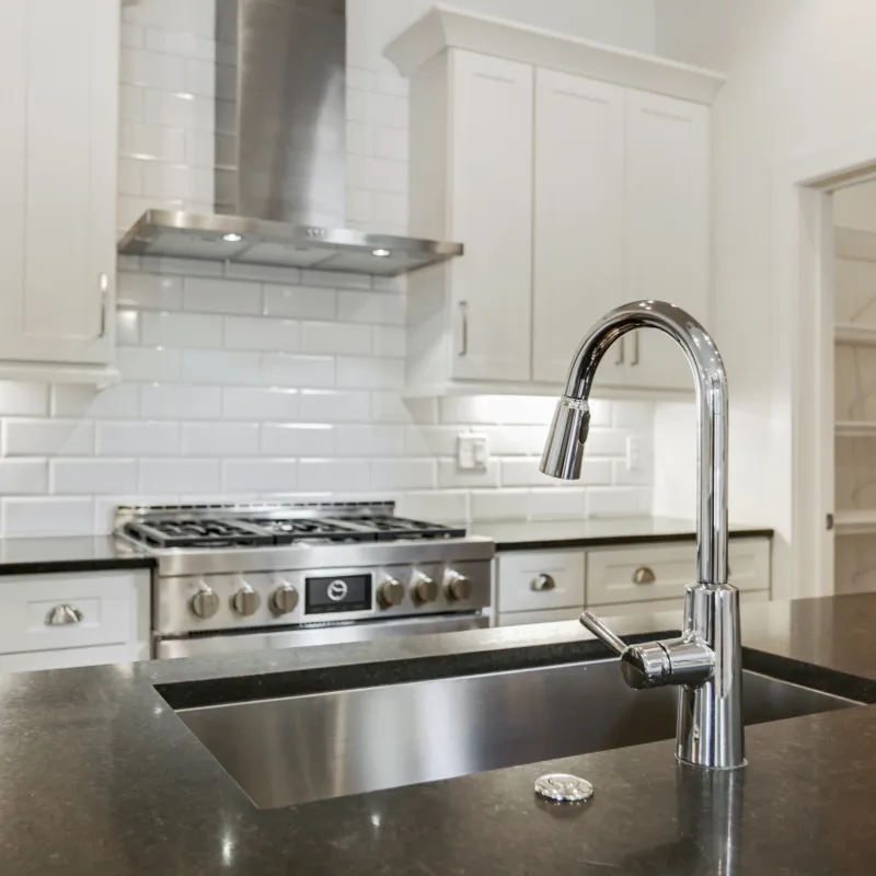 a kitchen with white cabinets