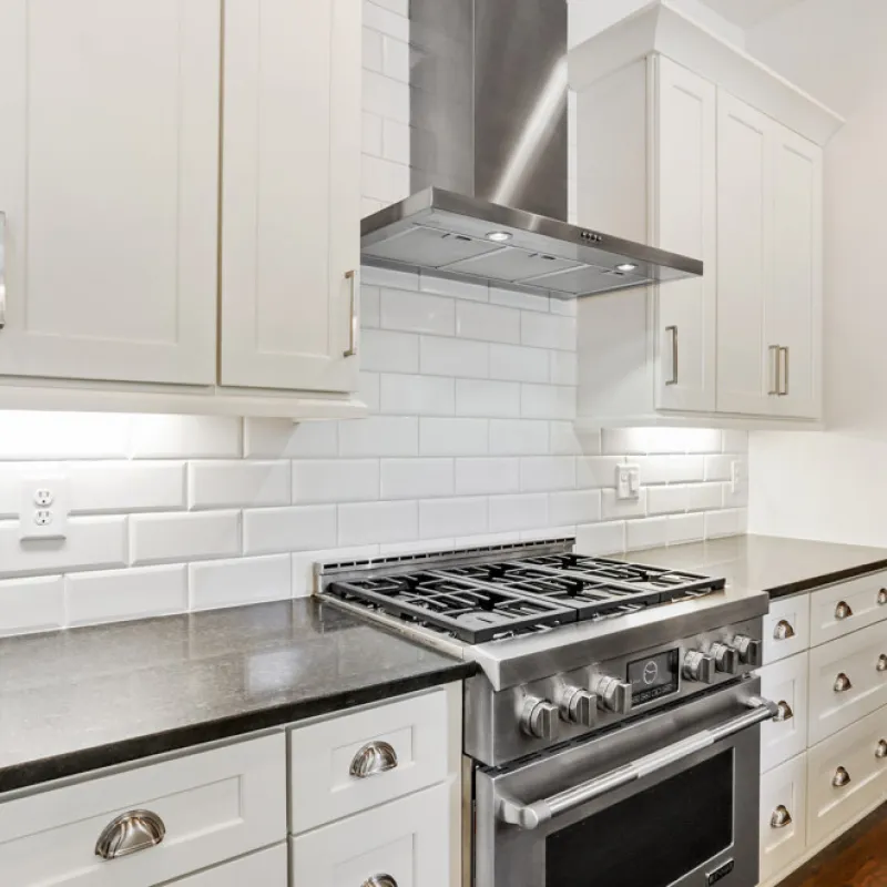 a kitchen with white cabinets