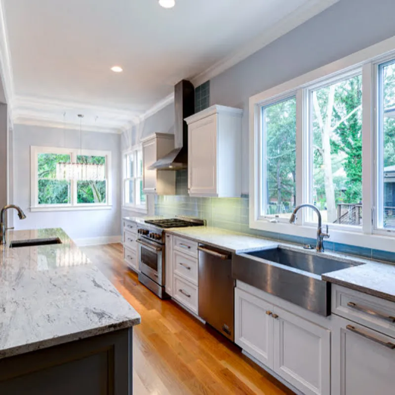 a kitchen with marble counters