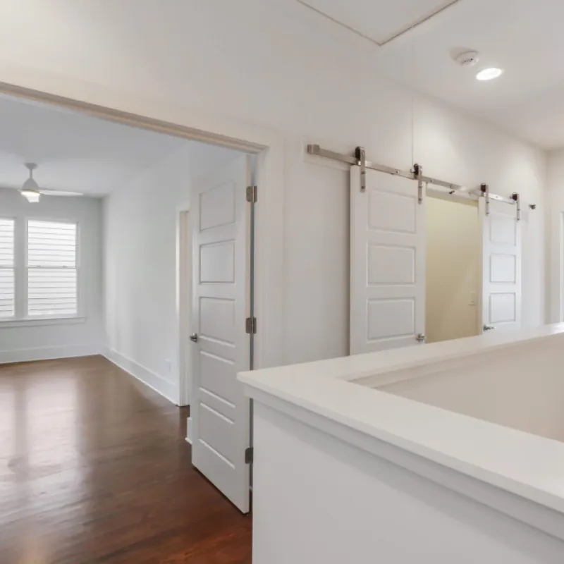 a bathroom with white cabinets