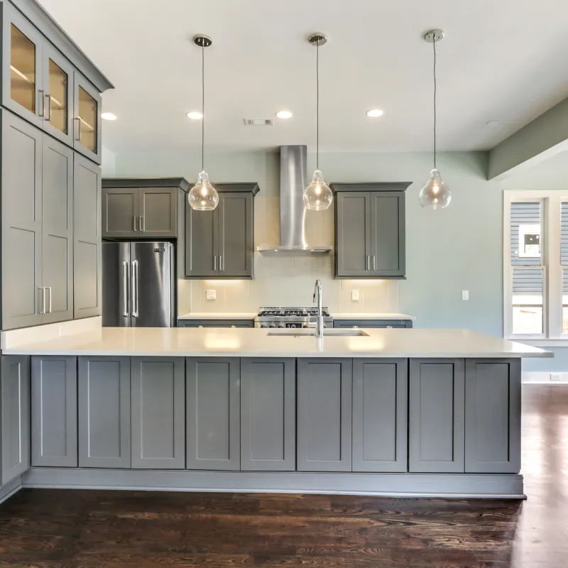 a kitchen with white cabinets