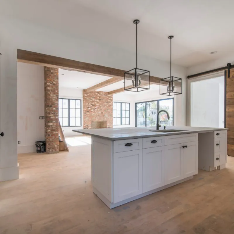 a kitchen with white cabinets