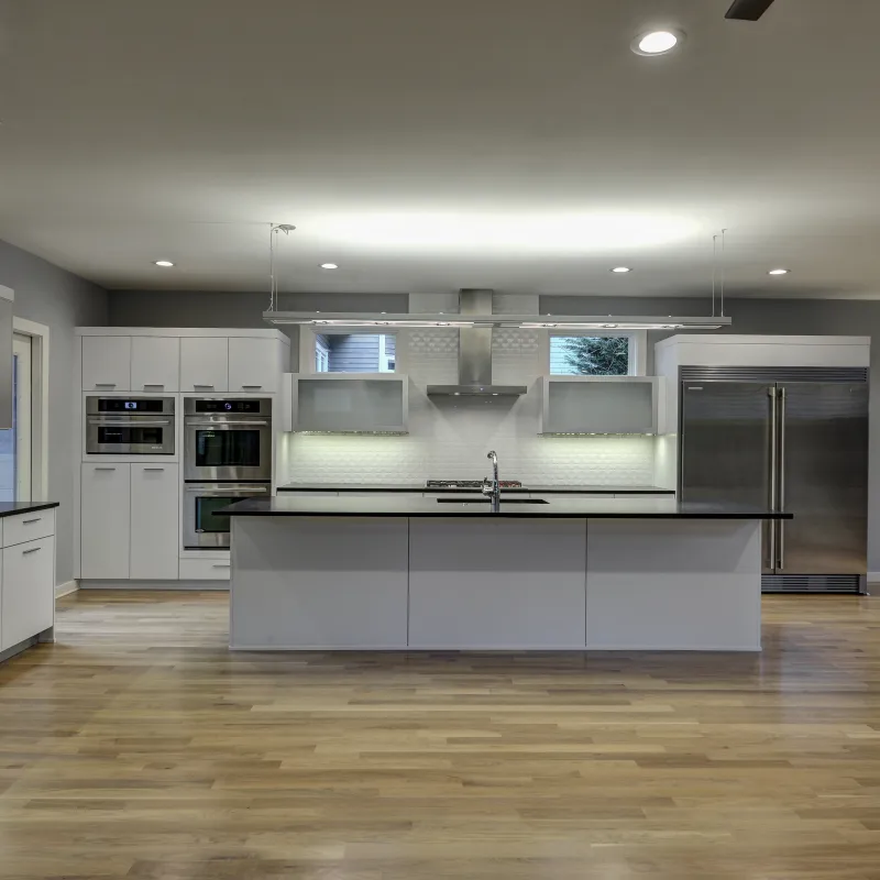 a kitchen with white cabinets