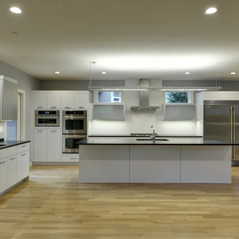 a kitchen with white cabinets