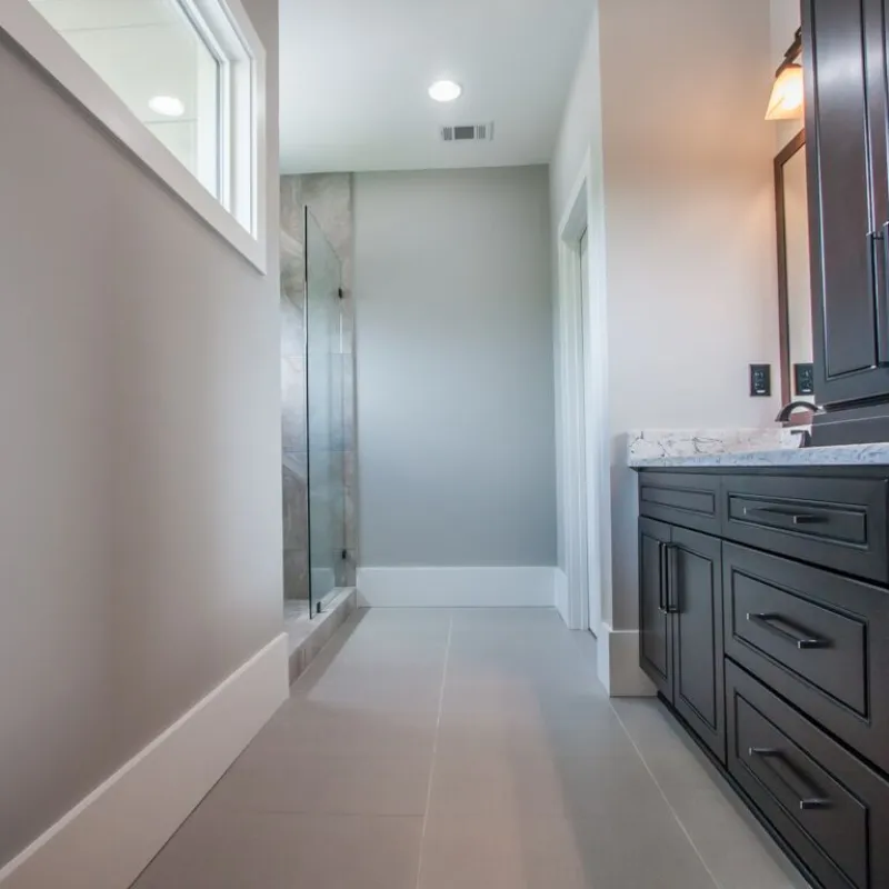 a hallway with black cabinets