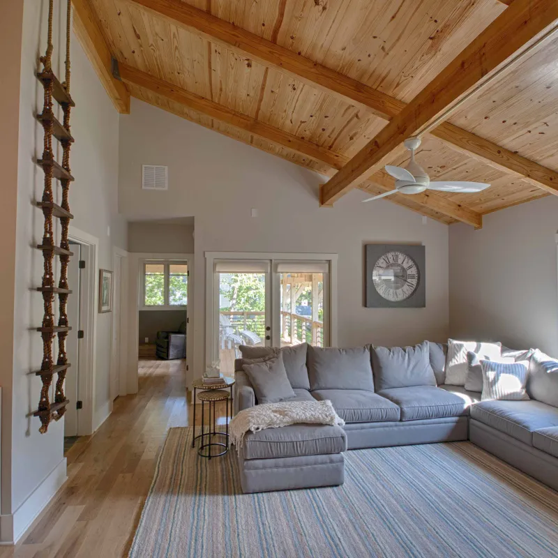 a living room with a wood ceiling
