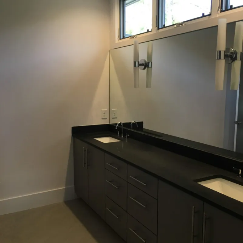 a bathroom with a sink and cabinets