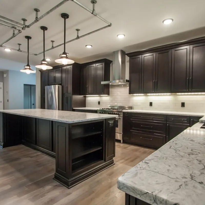a kitchen with black cabinets
