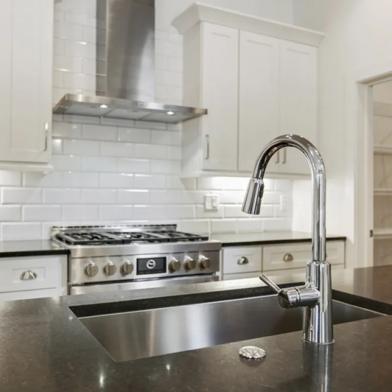 a kitchen with white cabinets