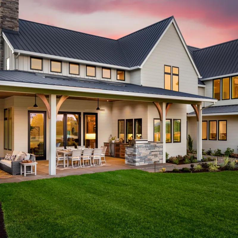 a house with a lawn and chairs
