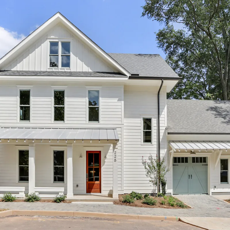 a white house with a garage