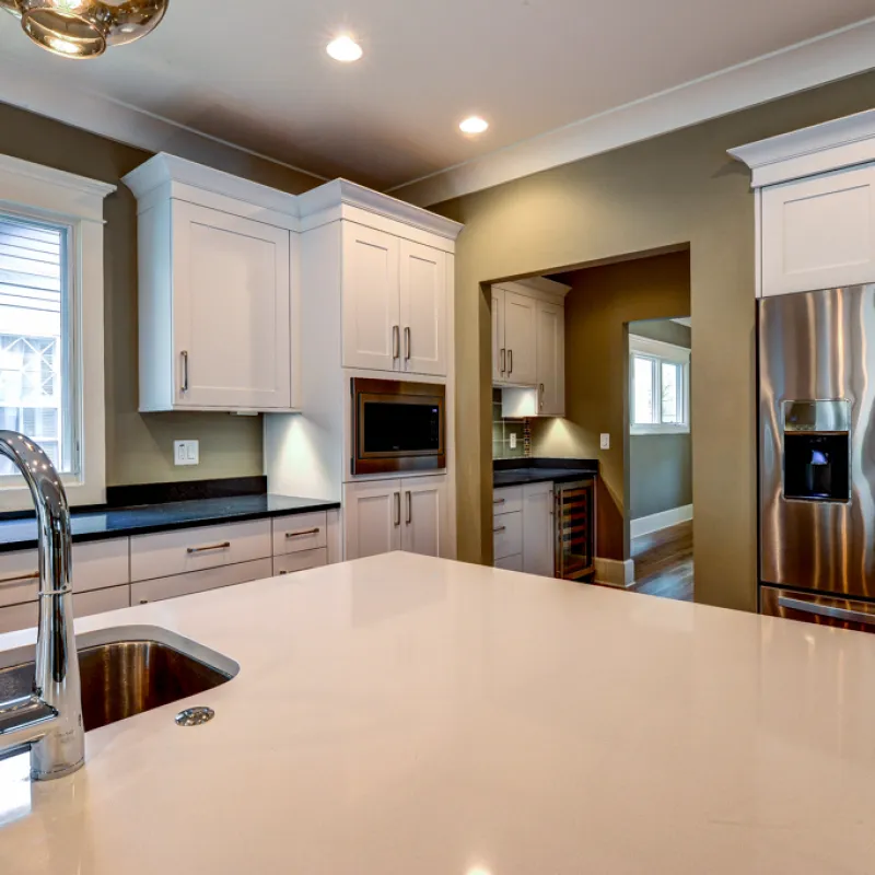a kitchen with white cabinets