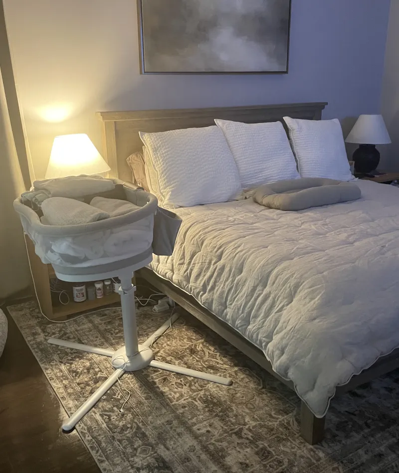MaidPro Alpharetta cleaned bedroom and baby's crib with a tucked in and made bed