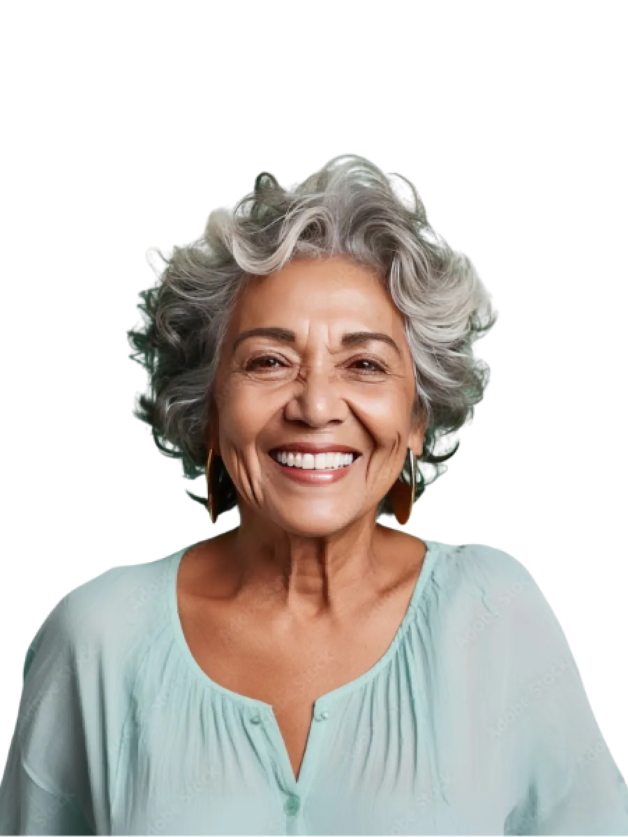 Smiling elderly woman with curly silver hair wearing light blue blouse and gold earrings against black background