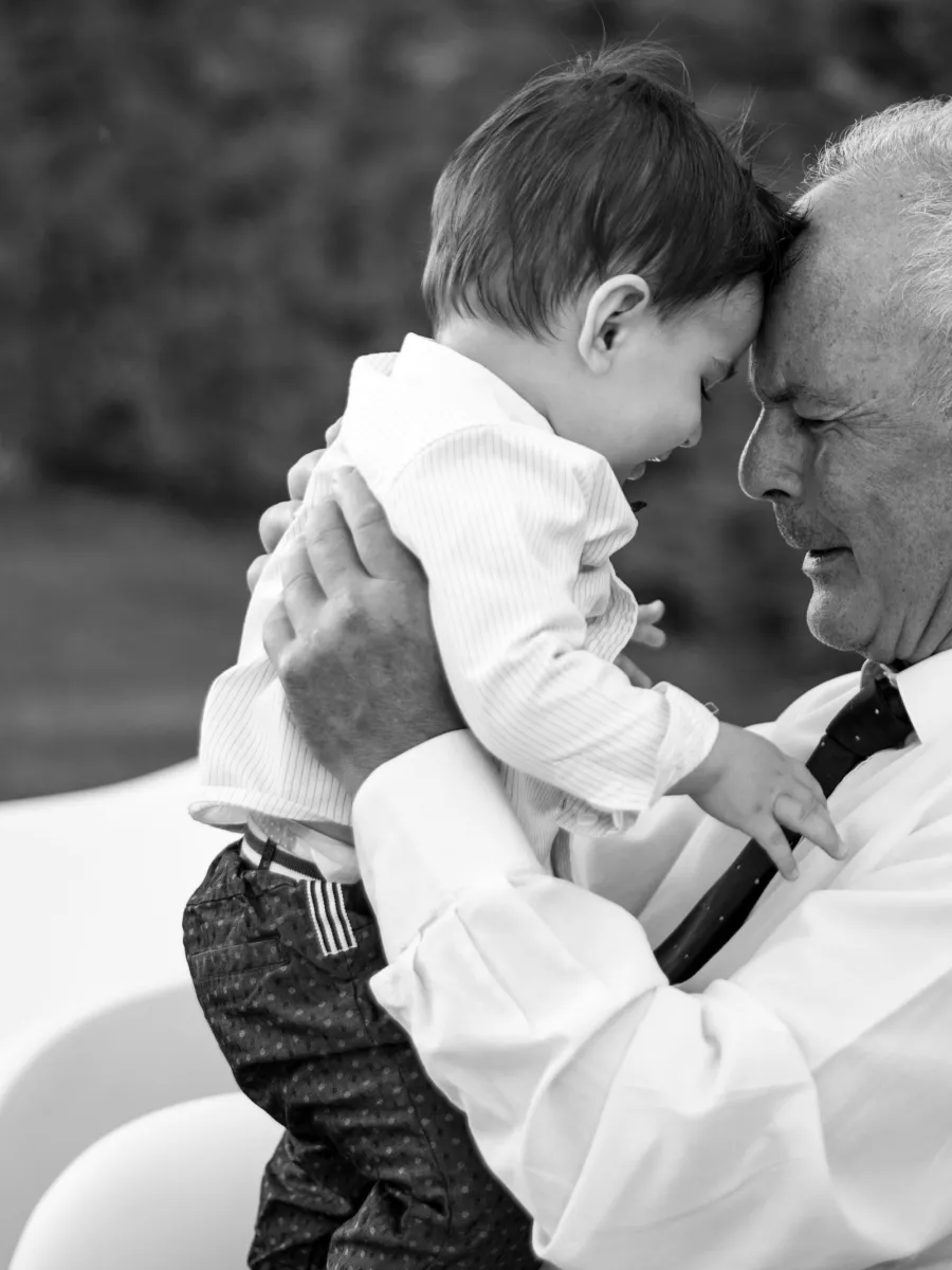 a man holding a baby