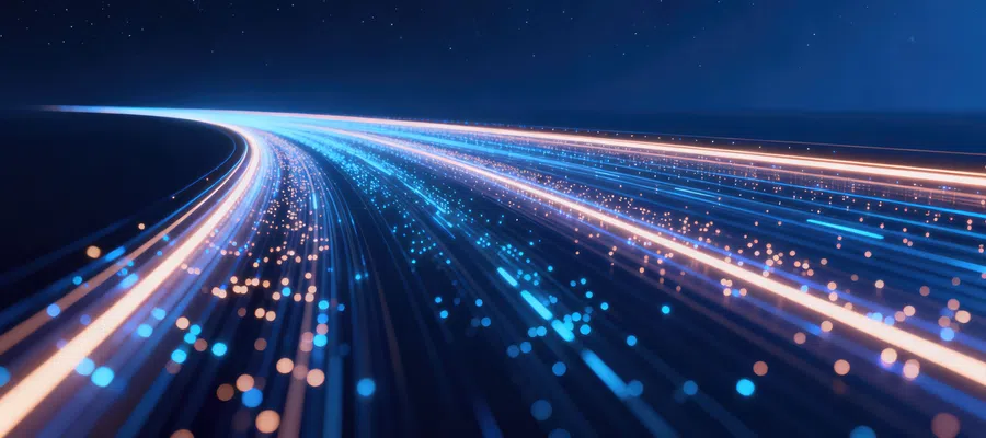 Curved streams of blue and orange glowing fiber optic light lines over dark background symbolizing data flow.