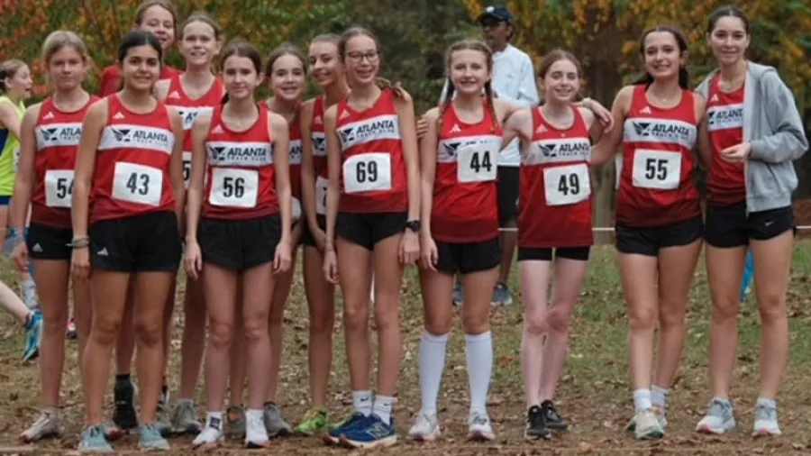 a group of women wearing numbers