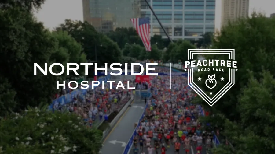 Crowd of runners at the start line of the Peachtree Road Race with Northside Hospital and race logos overlayed