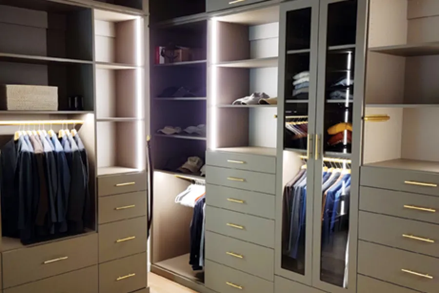 a closet with white cabinets