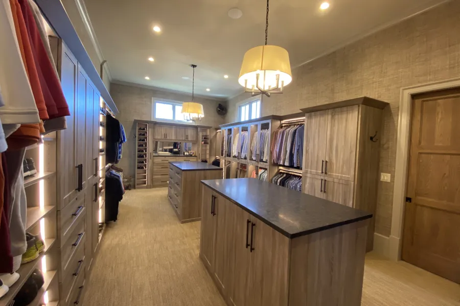 large walk-in closet with islands