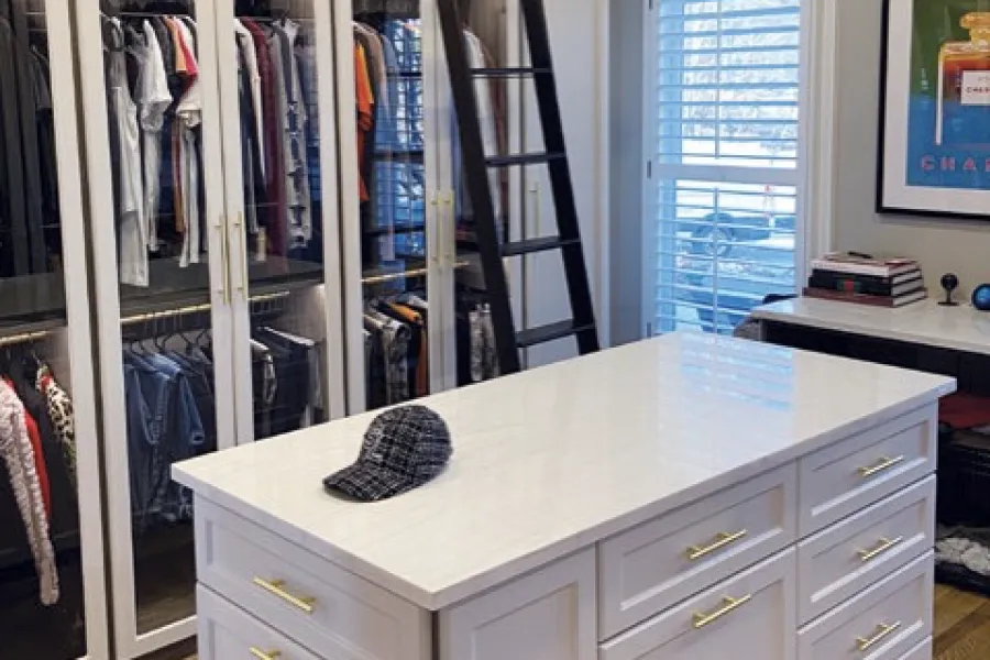 a white counter with a black cat on it