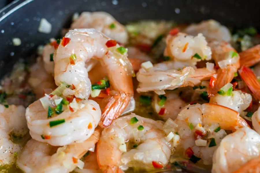 a bowl saucy shrimp