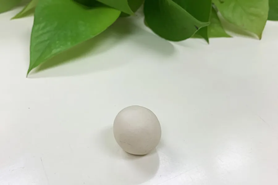 a close up of a rolled ball of clay