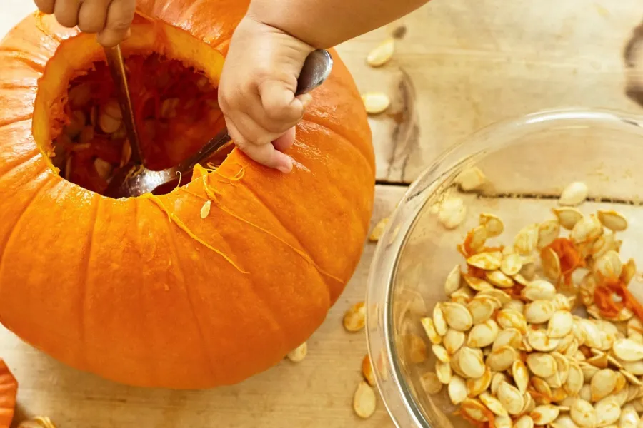 a person that is cutting some food on a table