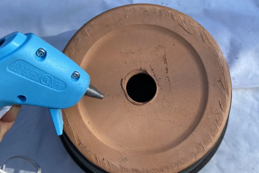 a blue hot glue gun and bowl