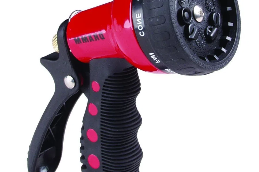 Red and black adjustable garden hose spray nozzle with ergonomic grip and multiple spray settings