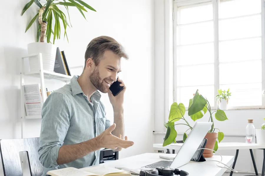 person in office with plants