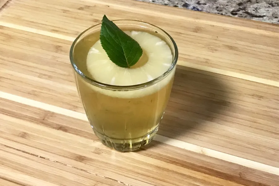 Spring break cocktail using fresh pineapple sage herble mint
