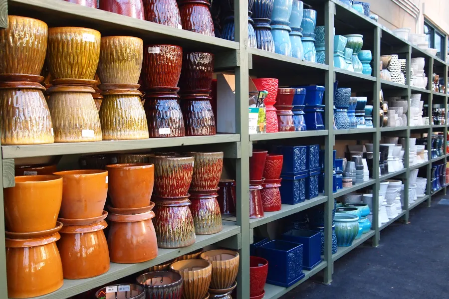 wall of pottery on shelves