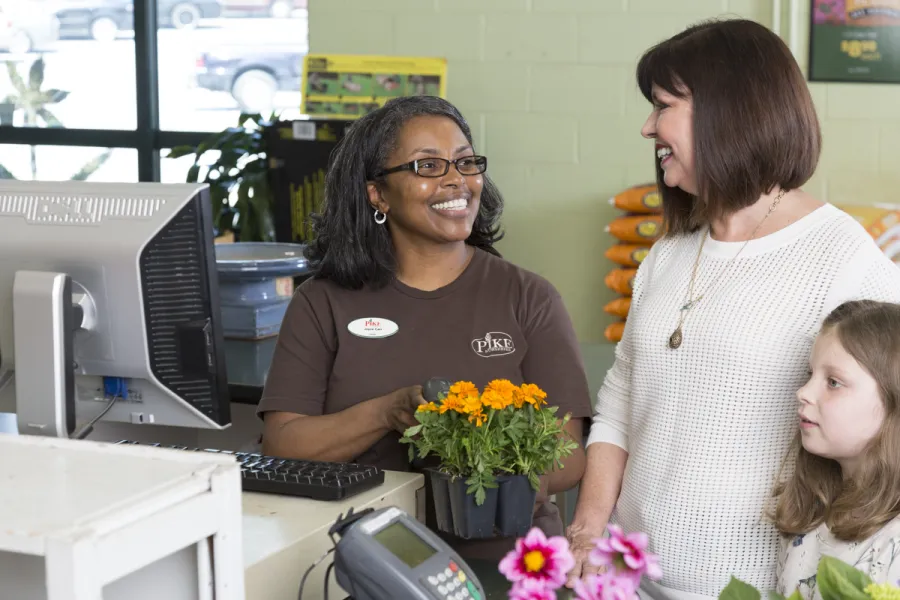 customer checking out with a smiling cashier