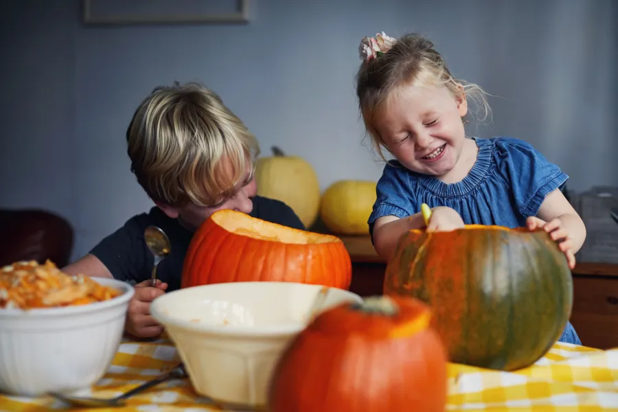 kids carving pumpkins