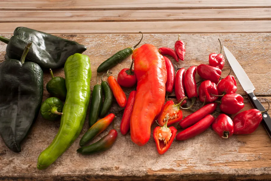 hot peppers on a cutting board