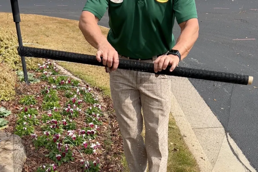 a man holding a large black and white sword