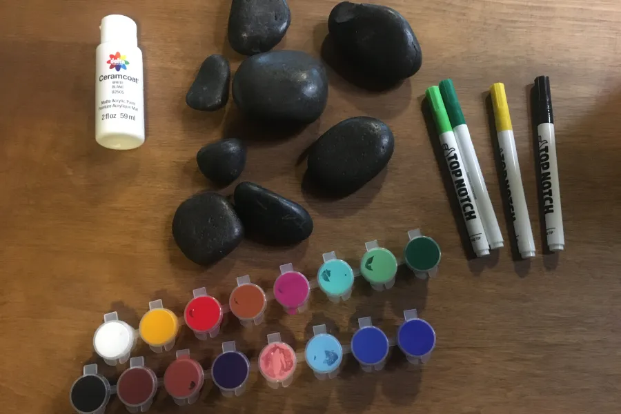 river rocks, paint and paint brushes