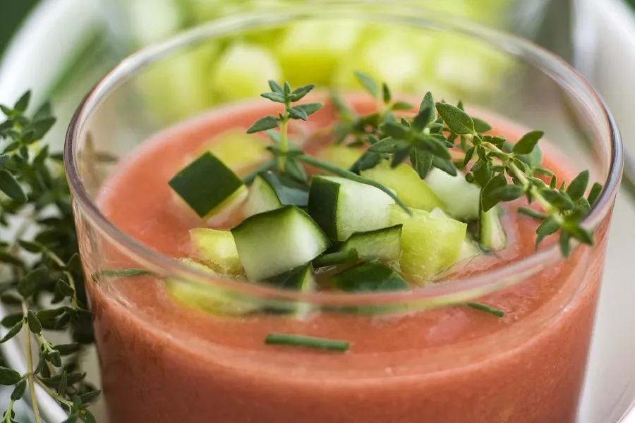 a close up of a cup of gazpacho