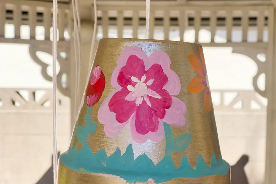 twine through hole in pot