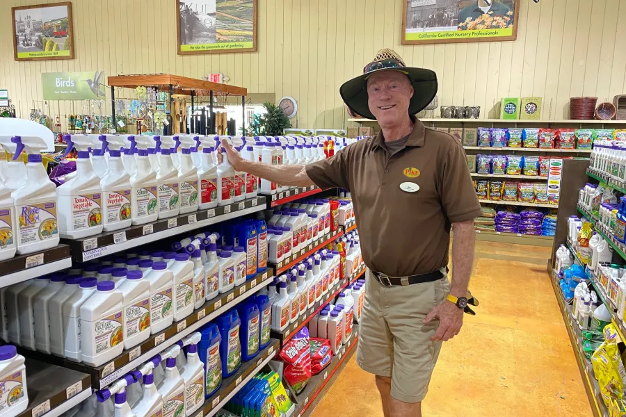a man standing in front of a store