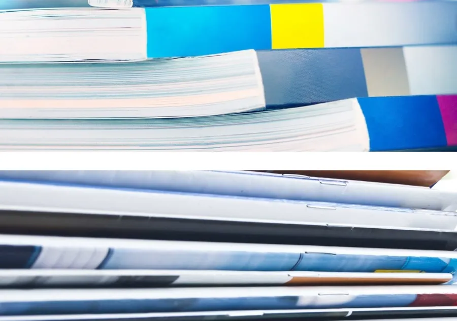 A stack of Perfect Bound books and a stack of Saddle Stitched books